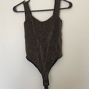 Stylish gold sparkle bodysuit